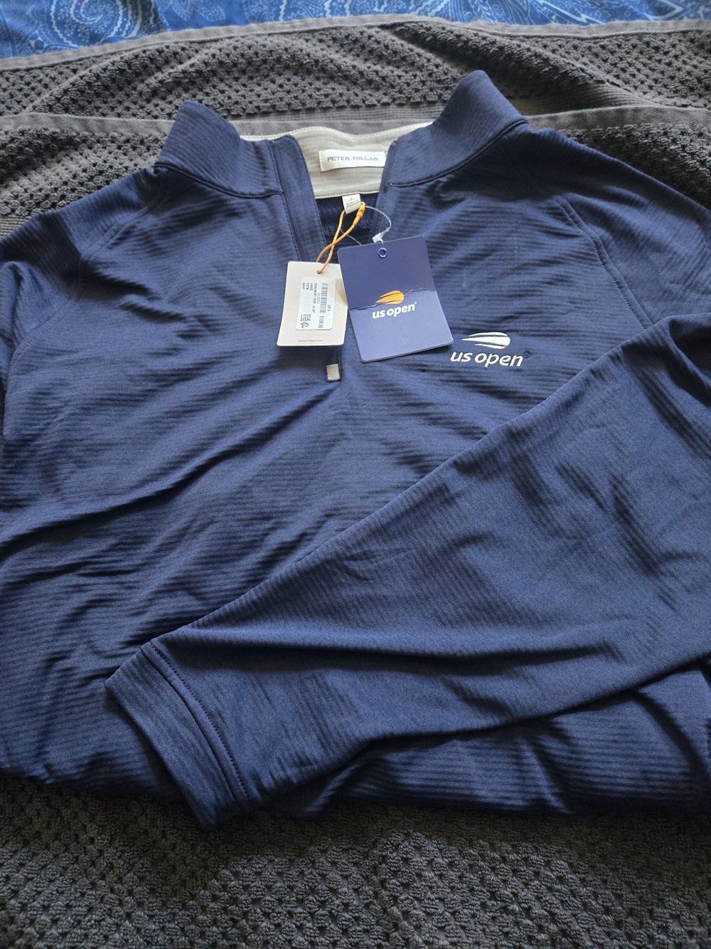 Peter Millar quarter-zip pullover with a US Open (tennis) logo